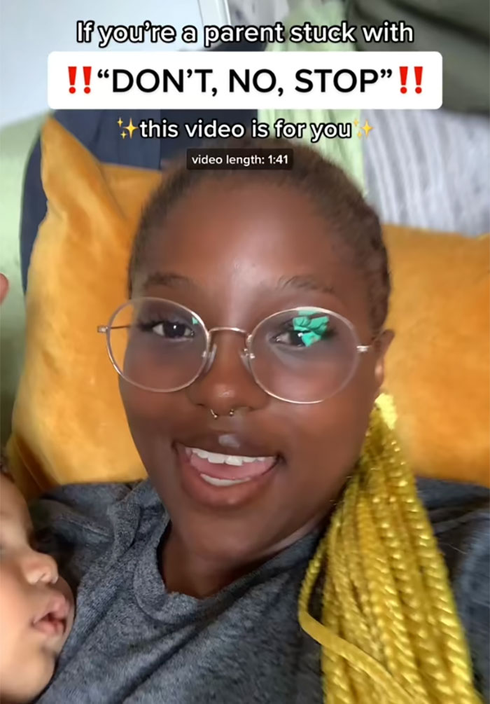 Mom sharing parenting tips with sleeping child, addressing parents stuck in “don't, no, stop” loop. Mom sharing parenting tips with sleeping child, addressing parents stuck in “don't, no, stop” loop.