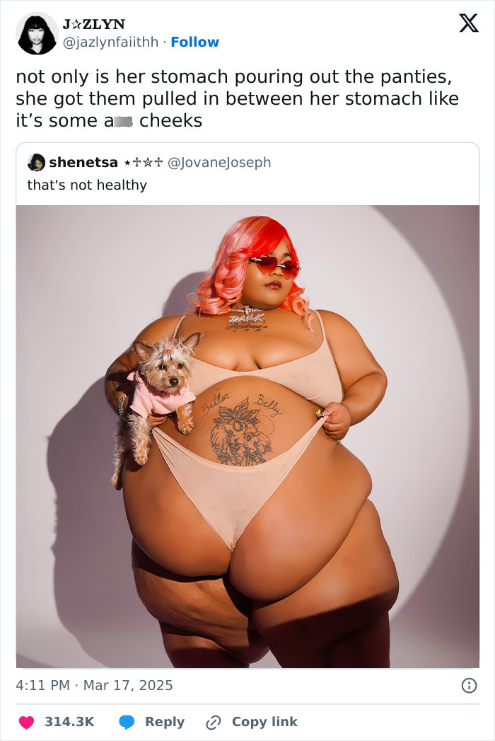 Plus-size rapper in viral photoshoot holding a small dog, showcasing tattoos and confidence. Plus-size rapper in viral photoshoot holding a small dog, showcasing tattoos and confidence.