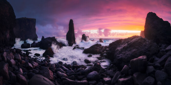 Stunning landscape with rocky shoreline at sunset, captured by a talented photographer.