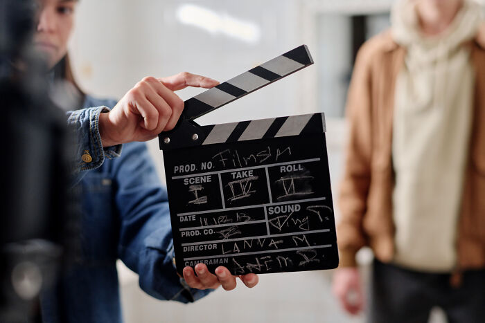 Film set clapperboard being used, symbolizing careers with "useless" degrees in action filming.
