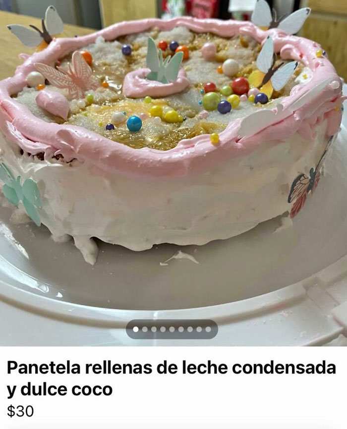 Baking fail cake with pink frosting, colorful candies, and paper butterflies, priced at $30.