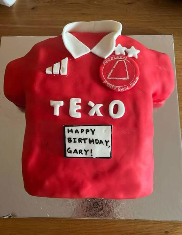 Red cake shaped like a soccer jersey with "Happy Birthday, Gary!" written on it, highlighting funny baking fails.