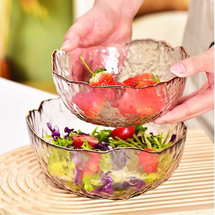 Glass bowls with strawberries and salad, perfect spring finds for your kitchen.