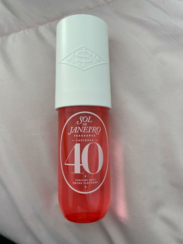 Sol de Janeiro Cheirosa 40 perfume mist bottle on a light fabric background.