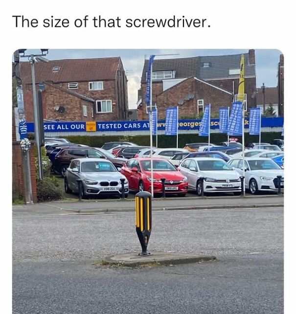 Humorous post featuring a bollard resembling a giant screwdriver in a car park.