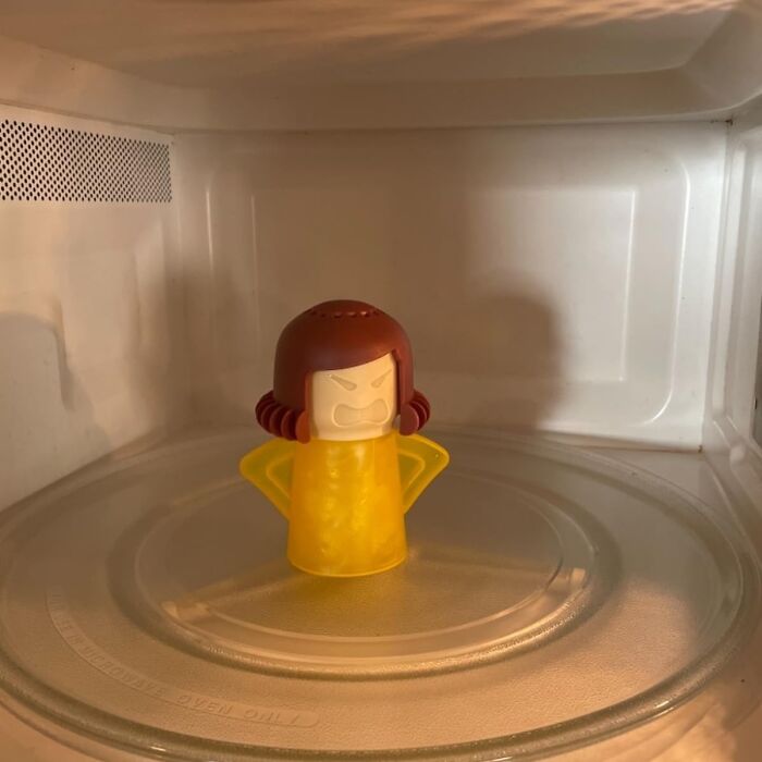 Plastic cleaner in a microwave, highlighting sneaky spots often missed in home cleaning.