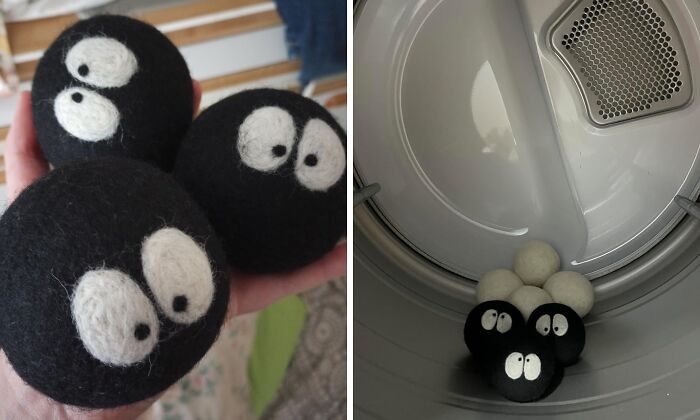 Black dryer balls with cartoon eyes, appearing ordinary but actually extraordinary, inside a laundry dryer.