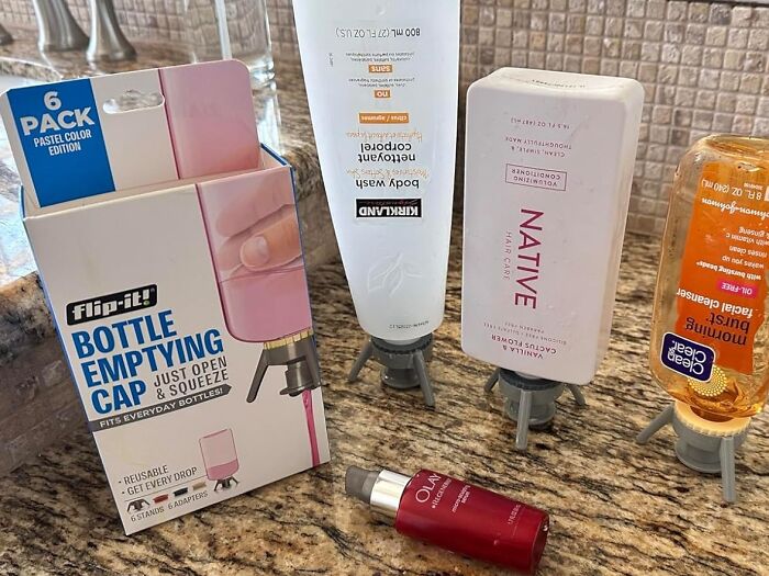 Bottle emptying caps on hygiene products, illustrating a frugal money saving tip to use every last drop.