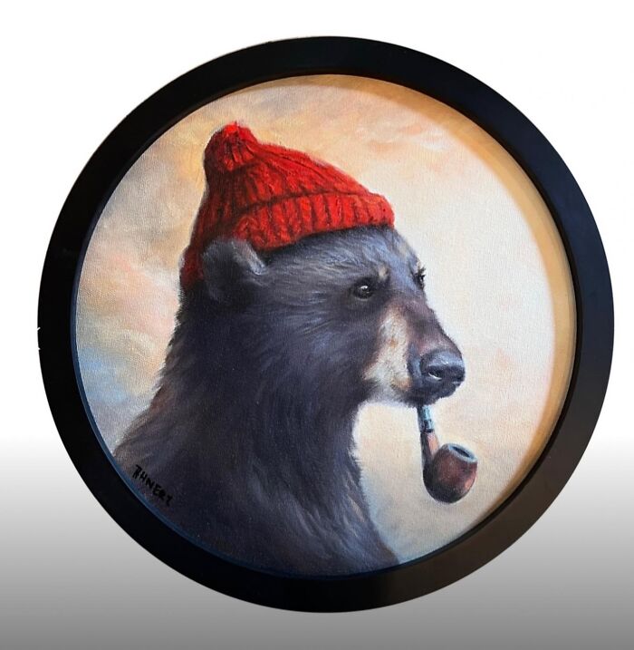 A bear wearing a red beanie and smoking a pipe, illustrating anthropomorphic themes by Richard Ahnert.