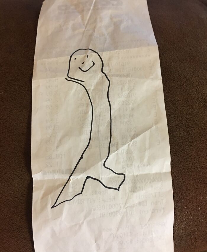 Receipt with a simple drawing of a smiling face, representing interesting receipts people found.