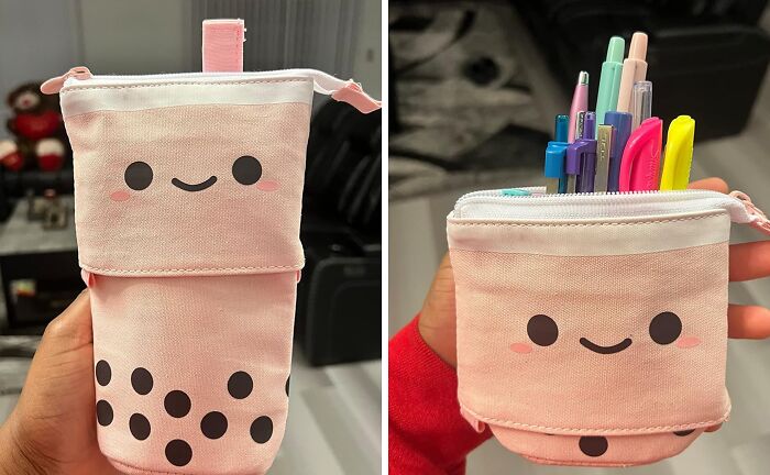 Cute pink expandable pouch with a smiling face, used for organizing pens—an affordable fix for clutter.