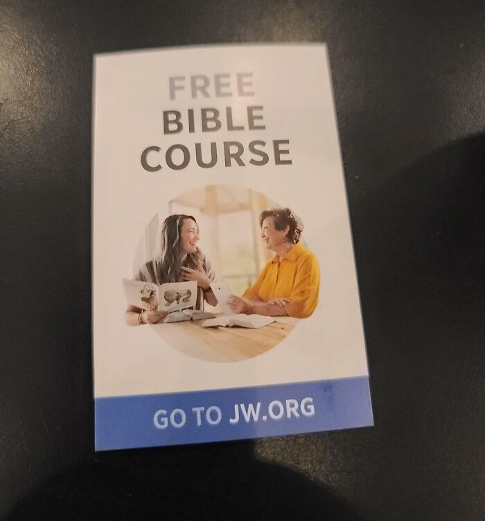 Pamphlet for a free Bible course, featuring two people smiling and reading together at a table.