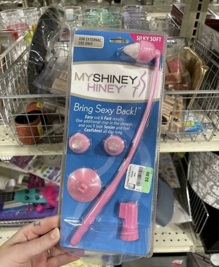 Packaging of a pink "My Shiney Hiney" brush kit displayed on a store shelf.