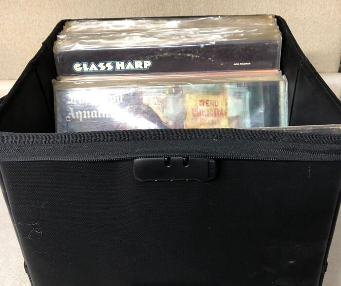 Box of vinyl records neatly organized for storing sentimental clutter.