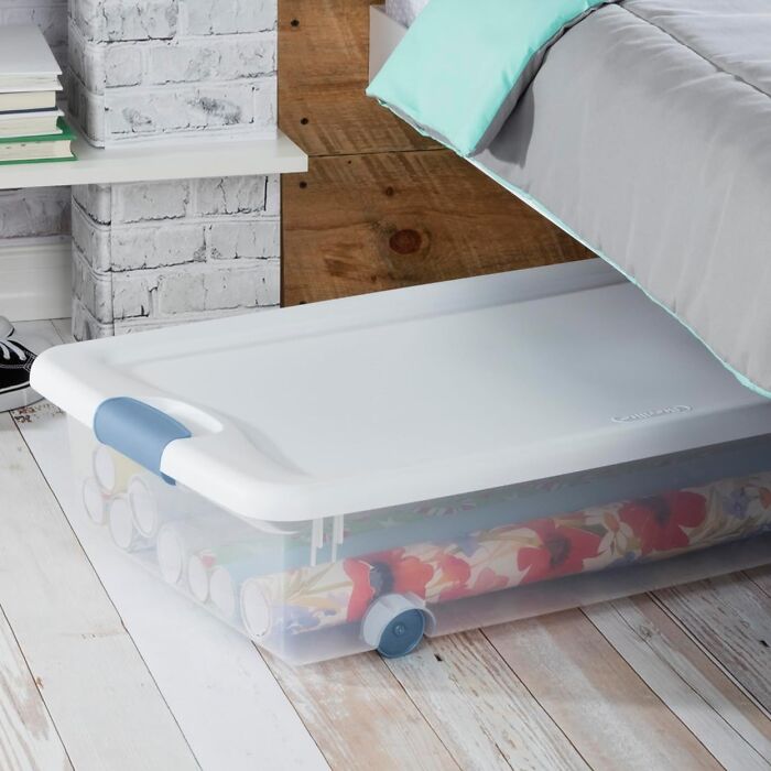 Under-bed storage box for organizing sentimental clutter.