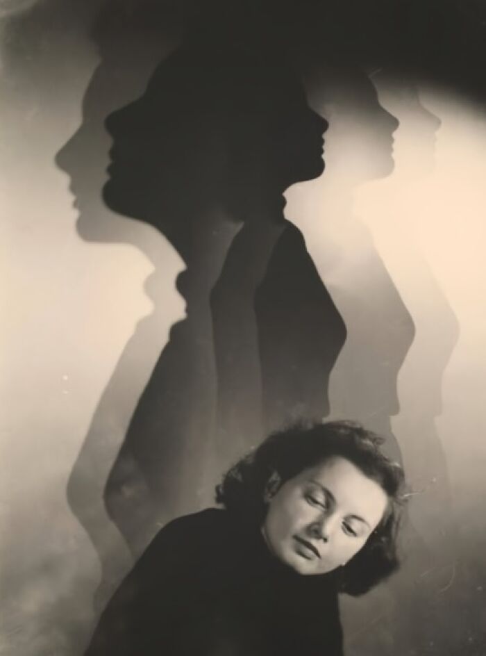 Vintage photo of a woman with closed eyes, her silhouette repeated. Nostalgia from over a hundred years ago.