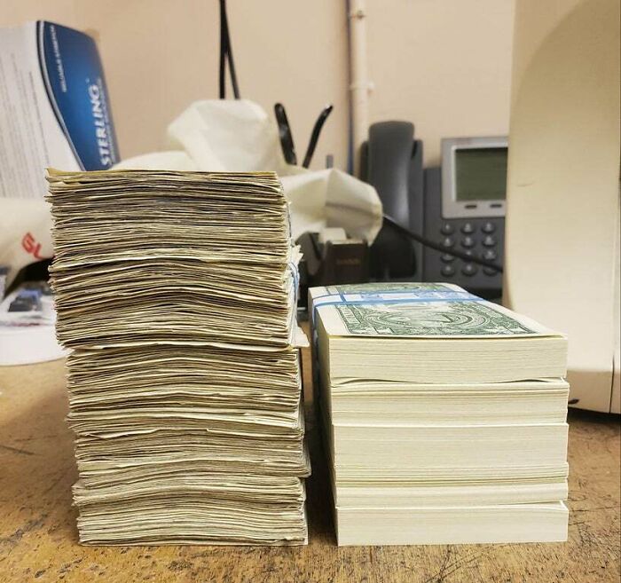 Stacks of worn bills next to new ones, showing things used over time differences on a desk.