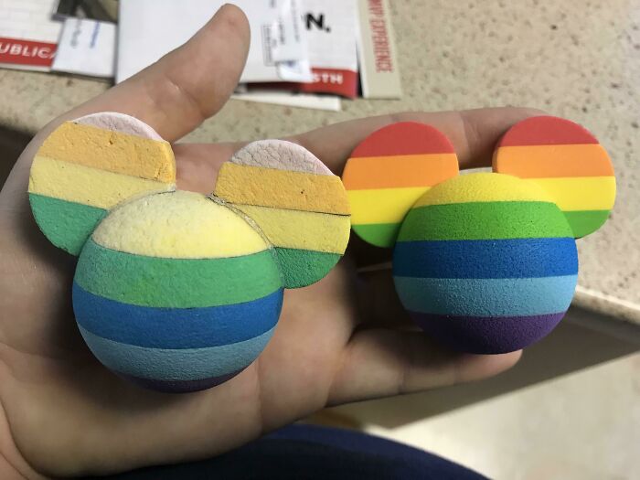 Colorful, rainbow-striped foam objects in the shape of mouse heads, illustrating wear and use over time.