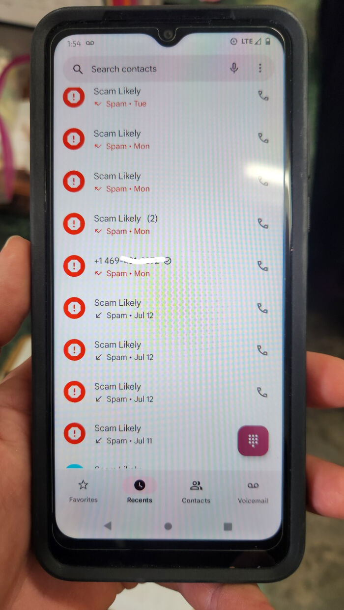 Smartphone screen showing multiple "Scam Likely" calls in the recent contacts list.