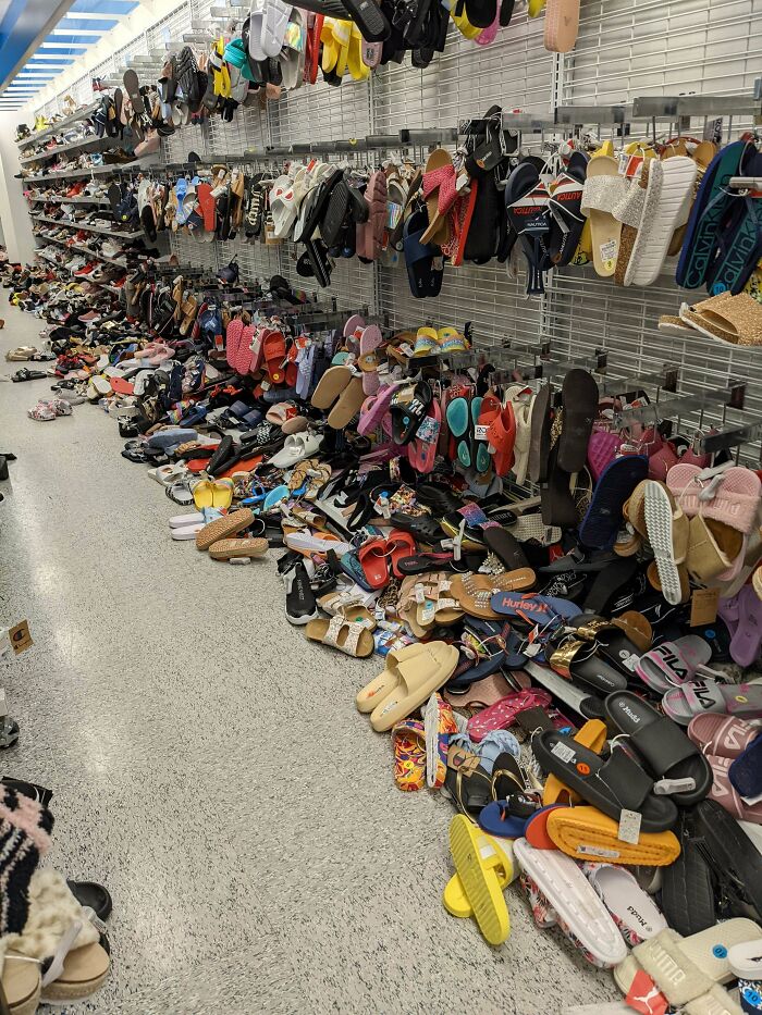 A chaotic shoe aisle with scattered footwear, illustrating extreme customer cluelessness.