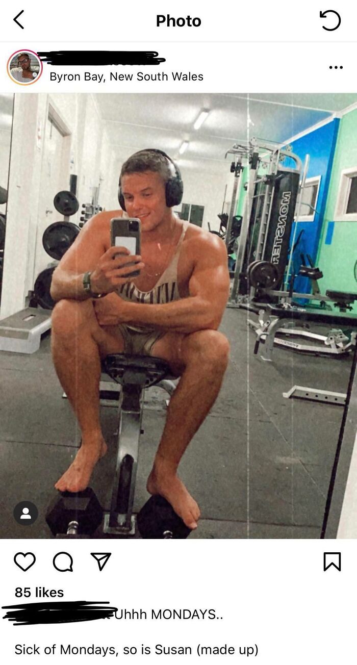 Influencers taking gym selfies, headphones on, seated on workout bench, gym equipment in background.