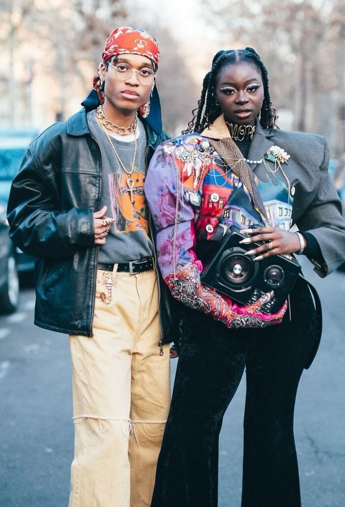 Visually striking street portrait of two stylish strangers in colorful outfits, highlighting urban fashion photography.