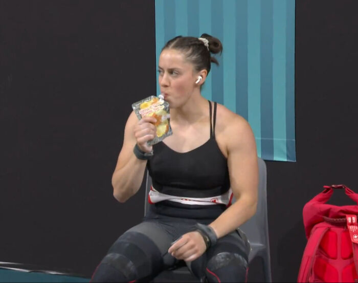Athlete sitting with a packaged snack, showcasing Just-Canada-Things.