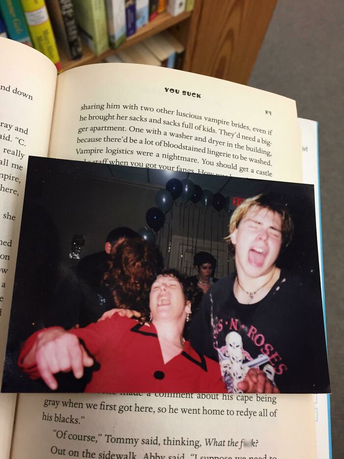 Photo used as a bookmark in an open book, capturing the unique love of book lovers.