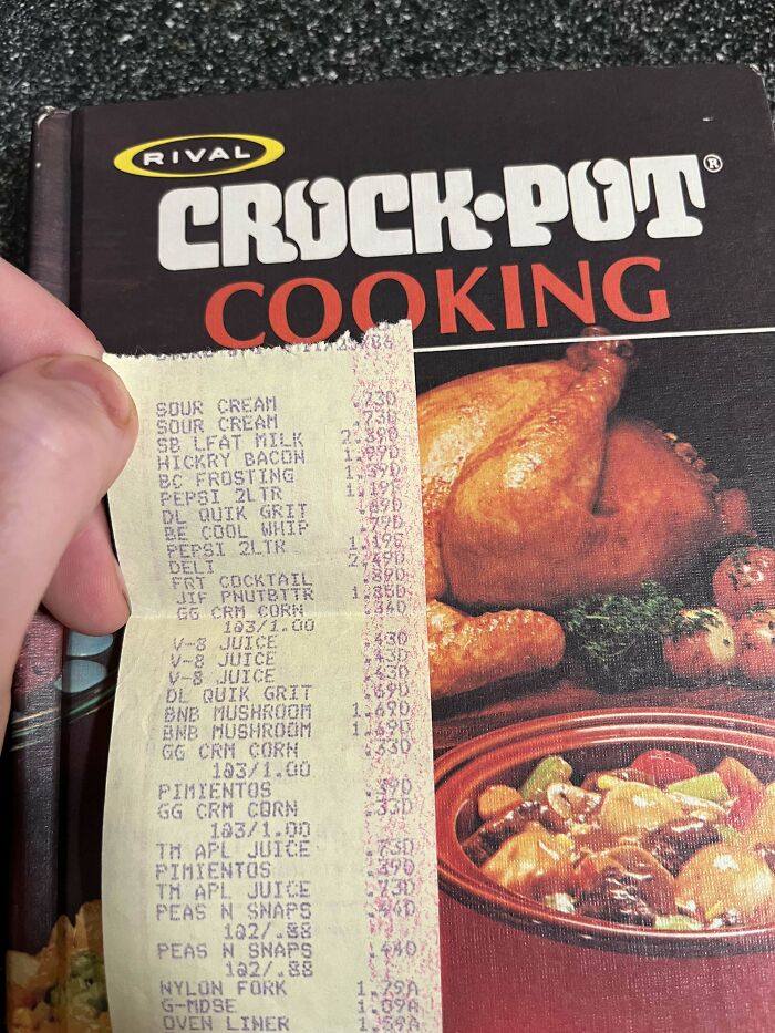 A cookbook with a grocery receipt bookmark, showcasing a book lover's unique find.