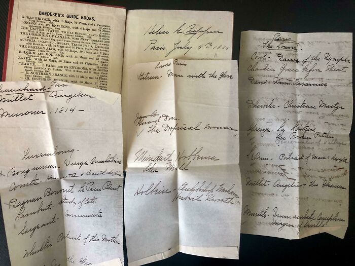 Handwritten notes used as cool bookmarks beside an open guidebook.