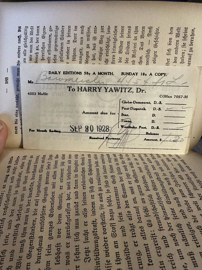 Old invoice used as a bookmark in a book, dated 1928.