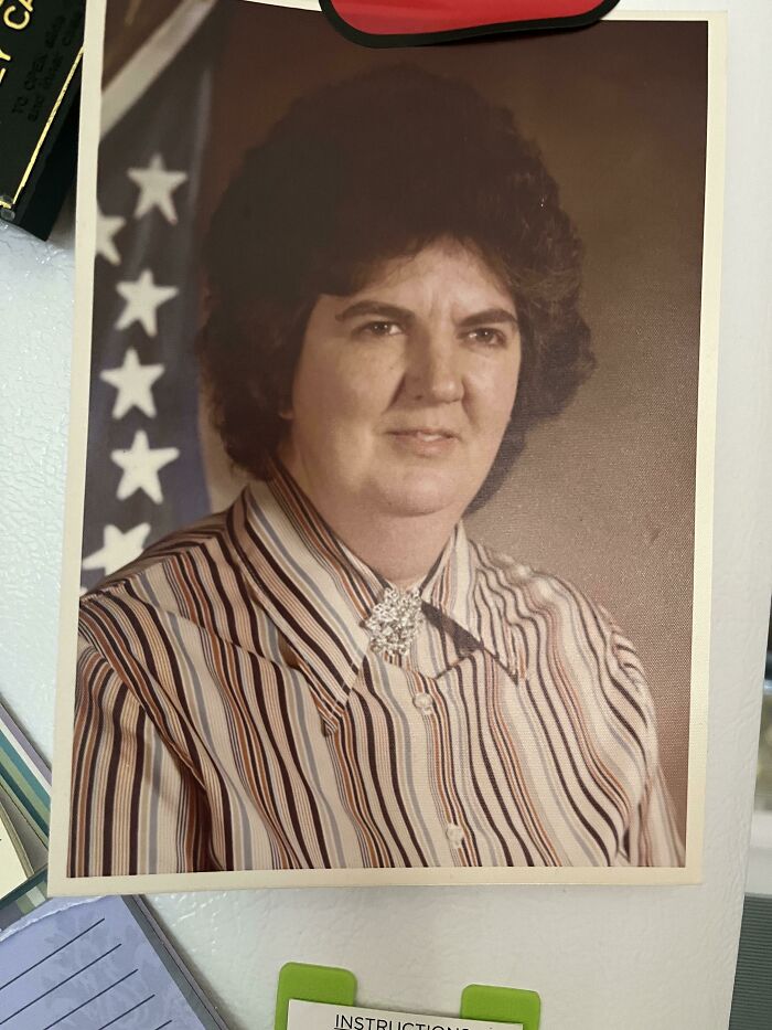 A vintage portrait photo used creatively as a unique bookmark by a book lover.