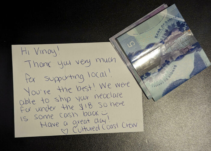 Handwritten thank you note and Canadian cash on a dark surface, representing local support, Just-Canada-Things.