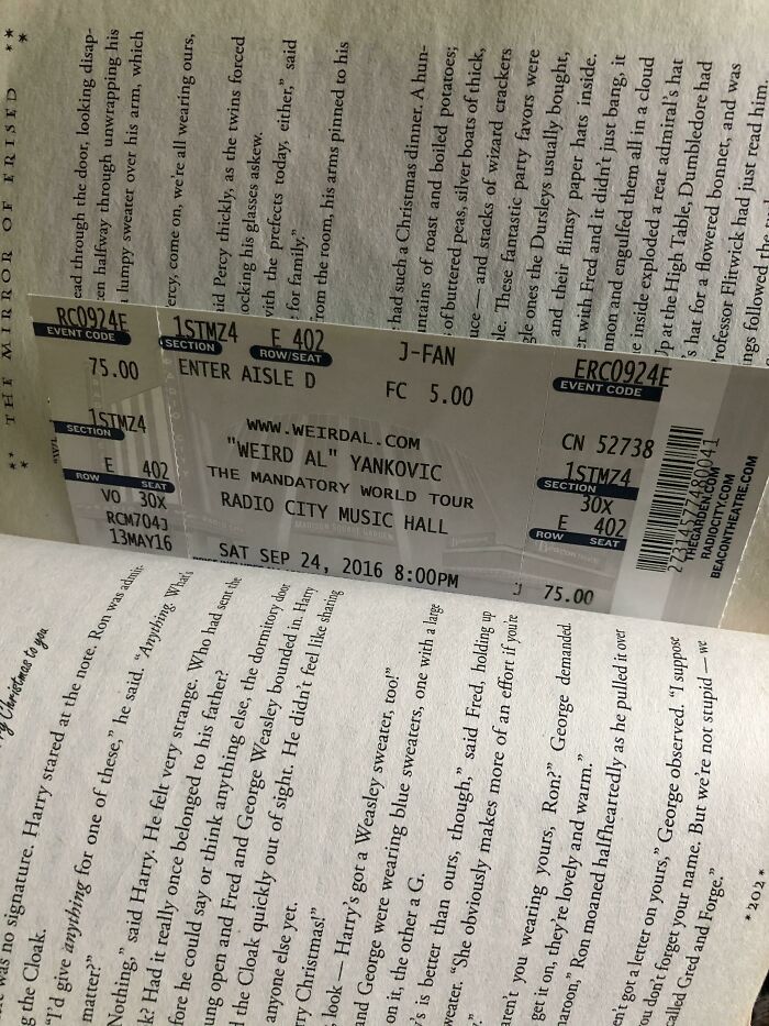 Concert ticket used as a bookmark inside a book by a book lover.