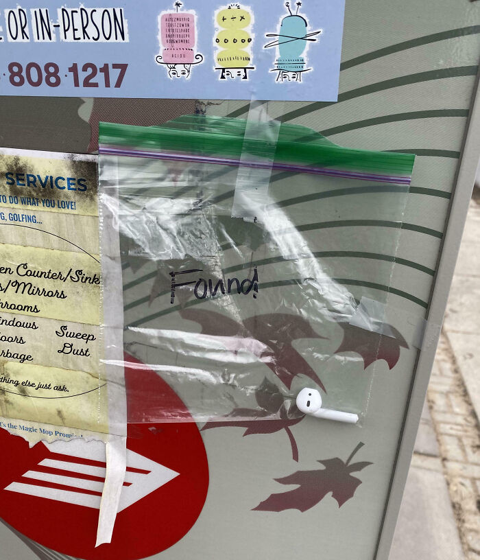 Plastic bag taped to a Canadian street mailbox with a found AirPod, illustrating unique moments in Canada.