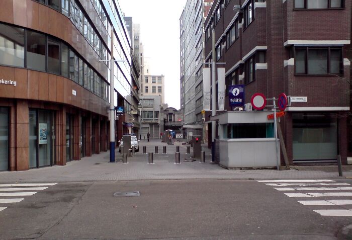 Urban street scene with tall buildings, ideal location for a real-life lost treasure hunt.