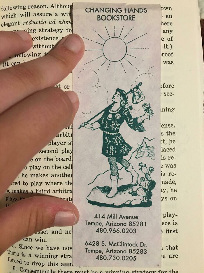 Unique bookmark from Changing Hands Bookstore featuring a whimsical character with a sun design, perfect for book lovers.