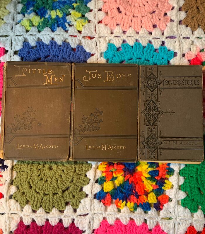 Three vintage Louisa May Alcott books on a colorful crochet blanket; a charming home discovery find.