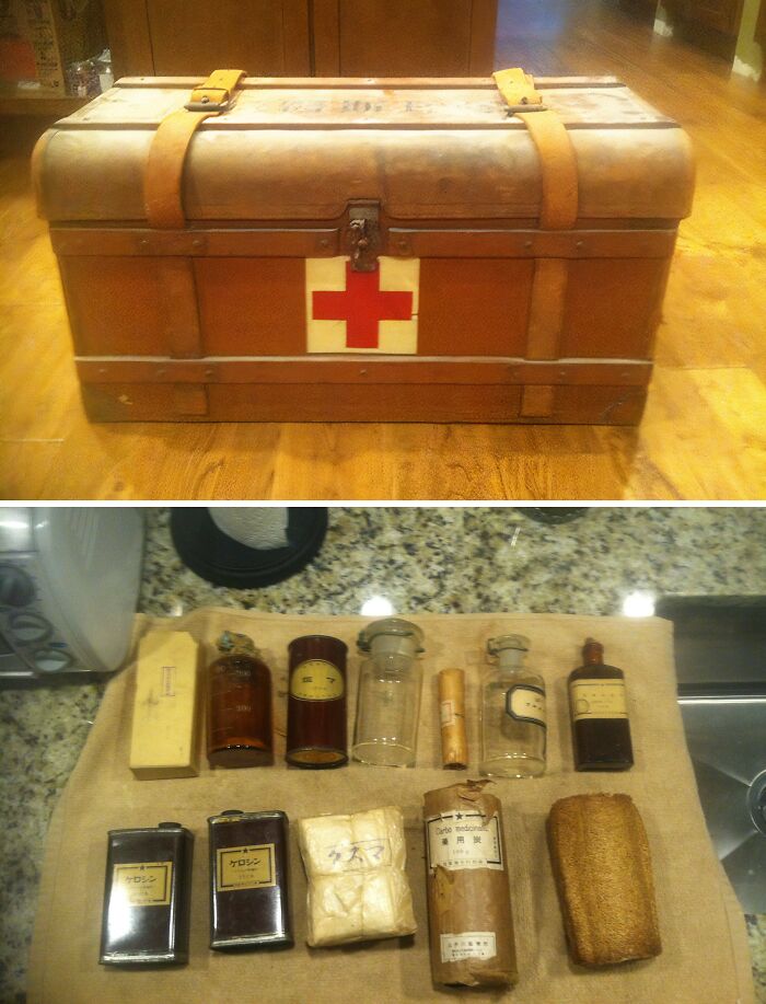 Antique medical chest with a red cross and vintage bottles on display, showcasing fascinating home-discovery finds.