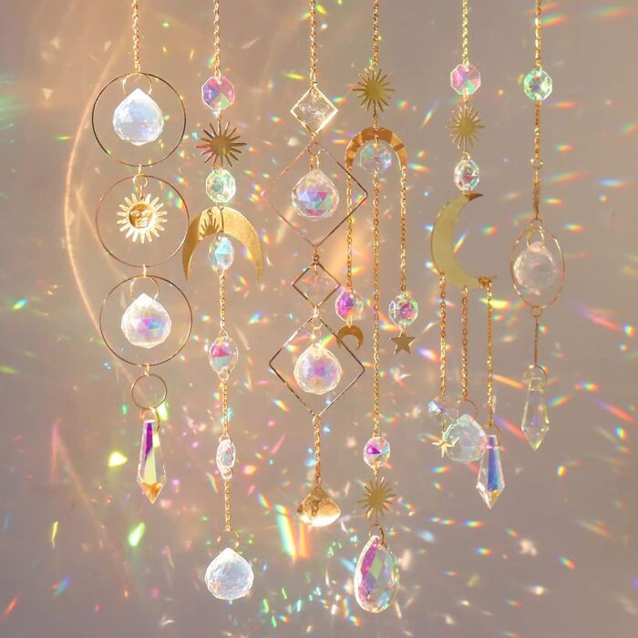 Crystal sun catchers with gold accents casting rainbow reflections. Most wished for home decor items.