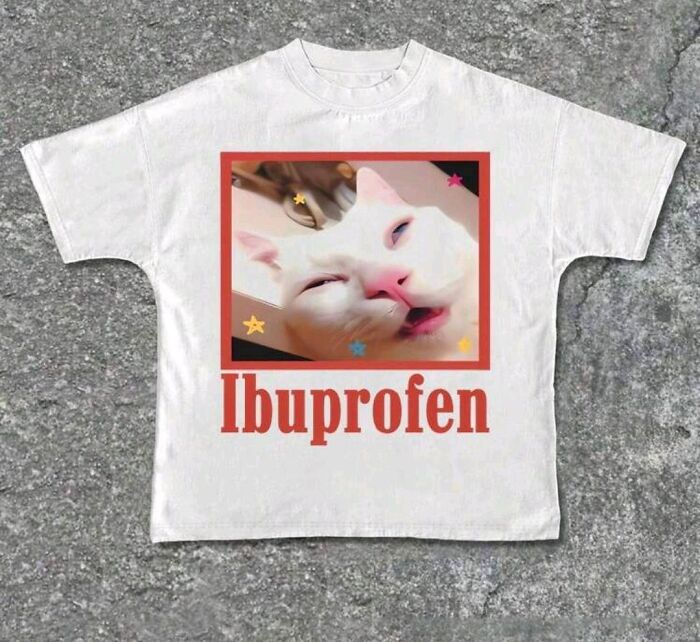 T-shirt featuring a funny cat image and the word "Ibuprofen," highlighting unacceptable fashion disasters.