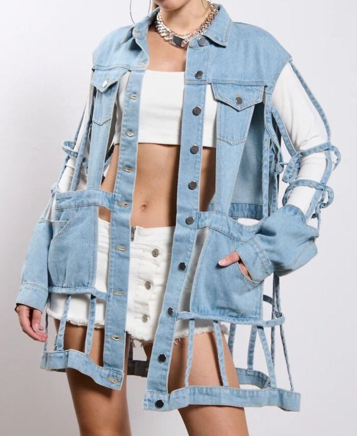 Denim jacket fashion disaster with cut-out design, showcasing controversial style choices.