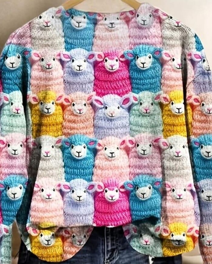Colorful sweater covered in knitted sheep pattern, highlighting a bold fashion disaster.