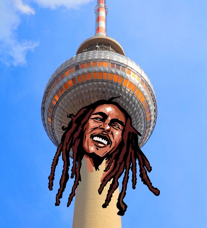 Illustration on a scenic tower photo by Robin Yayla featuring a smiling face with dreadlocks.