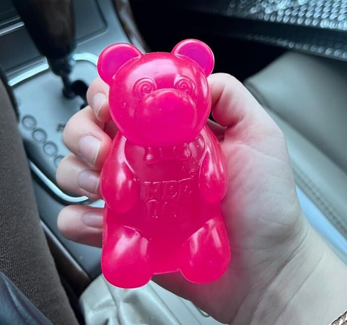 Person holding a pink bear-shaped soap made by a small business on Amazon.