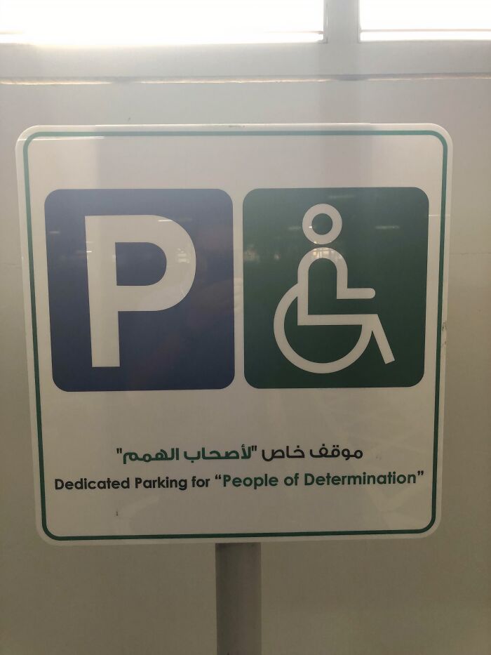 Sign in Dubai for "People of Determination" parking, featuring accessibility symbols.