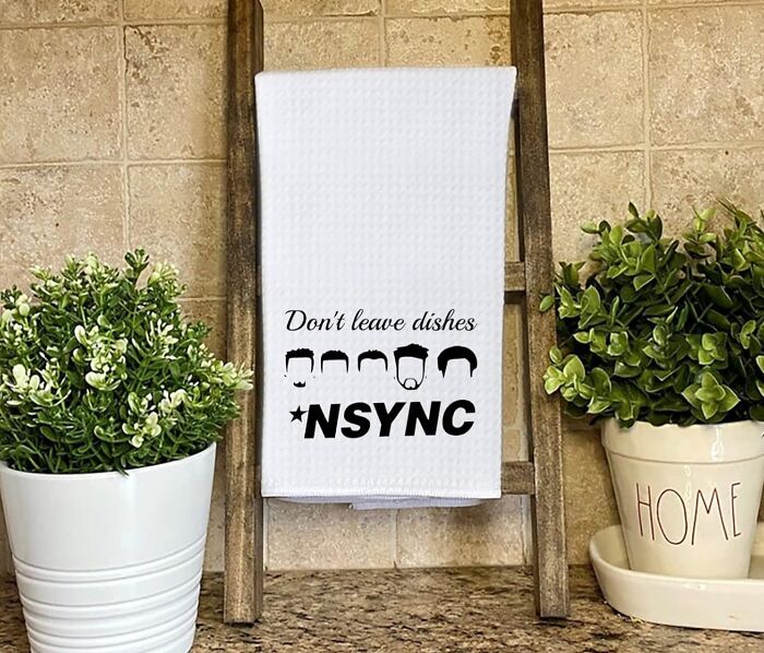 NSYNC-themed dish towel on a kitchen ladder with plants, perfect for 90s kids.