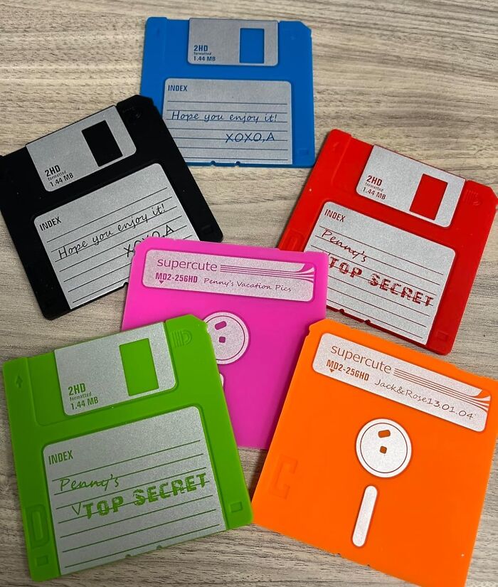 Colorful vintage floppy disks from the 90s arranged on a table.