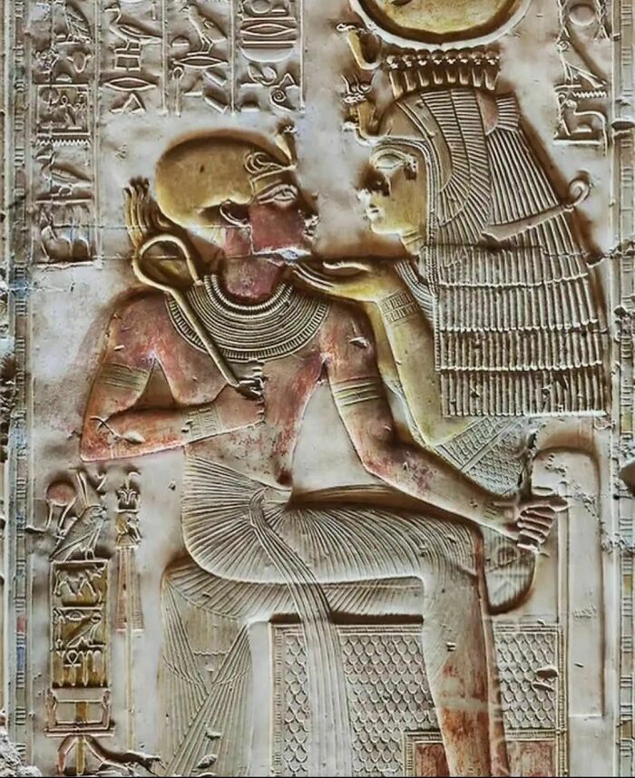 Ancient explorers stone carving depicting two Egyptian figures in detailed attire, showcasing historical preservation.