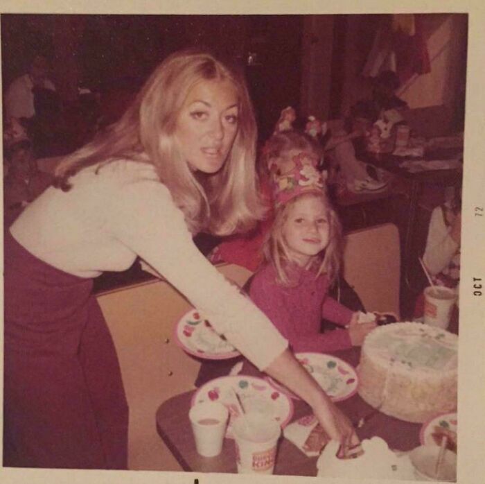 Vintage candid glimpse of a mother and daughter celebrating a birthday, capturing a moment from the past not in history books